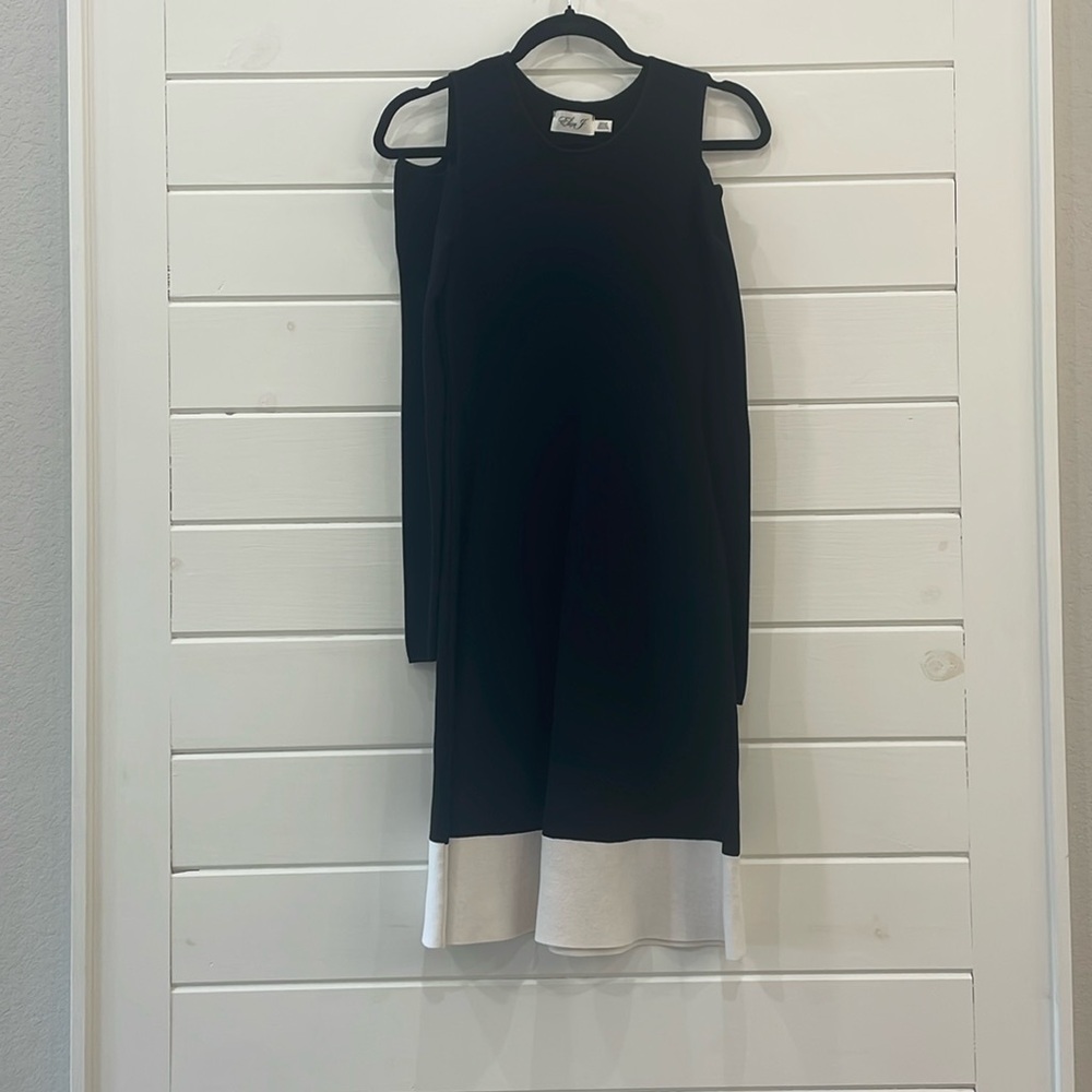 Very flattering, open shoulder dress.